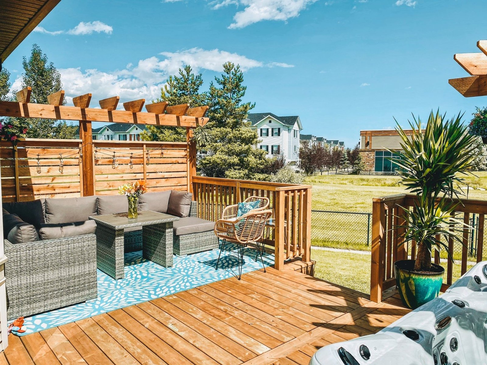Outdoor covered living space with privacy wall
